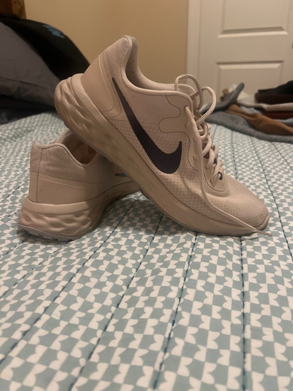 Nike Women's Light Beige Athletic Sneakers with Black Swoosh
